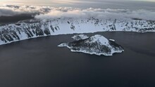 Drone Footage Of Crater Lake And Wizard Island, Winter Caldera Lake Covered With Ice And Snow, Drone Video, Oregon, USA