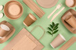 Eco-friendly tableware - kraft paper food packaging on light green background. Street food paper packaging, recyclable paperware, zero waste packaging concept. Flat lay