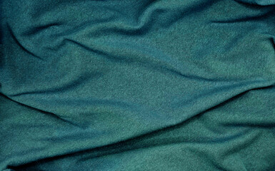Wall Mural - crumpled turquoise blue sackcloth texture use as backgrounfd. natural mood of cloth texture. close up of coarse fabric for backdrop. abstract creases on fabric with blank space for design.