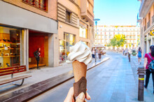 Woman Hand Holding Ice Cream Waffle Cone In The Old Town Girona, Catalonia, Spain