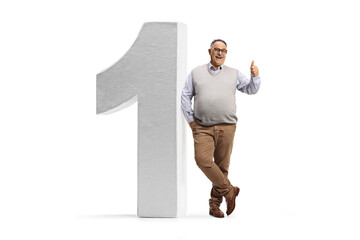 Poster - Full length portrait of a cheerful mature man leaning on a big number one and gesturing thumbs up