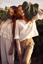 Two Beautiful Red-head Young Women Dressed In Vintage Clothes