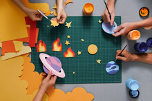 Multi-colored Paper Crafts On The Cutting Mat And Scrapbooking