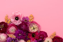 Warm Toned Flowers On Pink Background