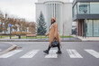 © Anna Berkut/Stocksy - confident black business woman crossing the road, street portrait