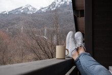 Anonymous Female Chilling On Balcony Near Mountains
