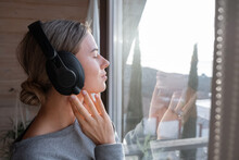 Relaxed Woman Listening To Music In Morning