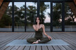© Milles Studio/Stocksy - Female touching forehead and meditating on terrace
