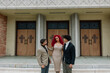 © Erin Brant/Stocksy - Modern mom with sons on church steps