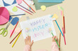© Yaroslav Danylchenko/Stocksy - Little kid painting creative greeting card for mother