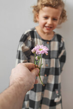 Father Giving His Little Daughter Spring Flower