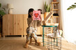© Eloisa Ramos/Stocksy - Girl showing artwork for mothers day