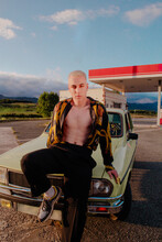Blonde Boy Stand In Vintage Car