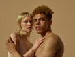 © ohlamour studio/Stocksy - fashionable couple - skincare - scars - earth tones
