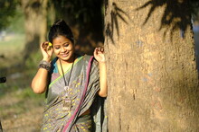 Indian Woman Portrait Standing Beside A Tree At Outdoors In Evening
