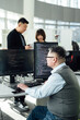 © ZQZ Studio/Stocksy - Portrait of Chinese male engineer with computer in office