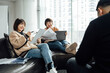 © ZQZ Studio/Stocksy - Casual business people discussing in meeting area of office