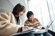 © ZQZ Studio/Stocksy - Two casual businesswoman talking in office