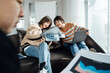 © ZQZ Studio/Stocksy - Casual business people discussing in meeting area of office