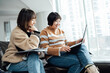 © ZQZ Studio/Stocksy - Two casual businesswoman talking in office