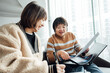 © ZQZ Studio/Stocksy - Two casual businesswoman talking in office