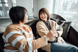 © ZQZ Studio/Stocksy - Two casual businesswoman talking in office