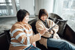 © ZQZ Studio/Stocksy - Two casual businesswoman talking in office