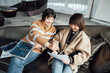 © ZQZ Studio/Stocksy - Two casual businesswoman talking in office