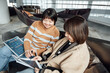 © ZQZ Studio/Stocksy - Two casual businesswoman talking in office