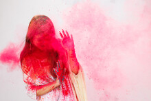 Young Woman Enjoying Holi,the Festival Of Color 