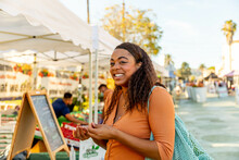 Woman Smiles At The Farmer's Market