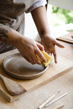 Close Up Of Woman Making A Ceramic Dish
