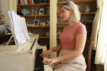Young Woman Playing Piano