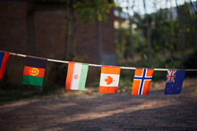 Various National Flags At Sunset