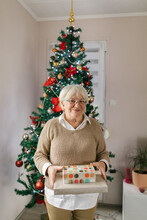 Boomer Woman Giving Christmas Presents Away