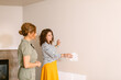 © ByLorena/Stocksy - Interior designer choosing wall colors with client