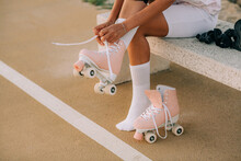 Female Tying Roller Skates