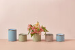 © Yaroslav Danylchenko/Stocksy - Various tin cans of pastel paints decorated with flowers
