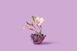 © Yaroslav Danylchenko/Stocksy - Healing amethyst crystal with fresh spring flowers