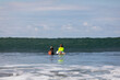 © Raymond Forbes LLC/Stocksy - Nervous Young Boy Learning to Surf in Costa Rica with surf instructor