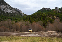 Minibus Camper Van In The Middle Of Nature Between Mountains