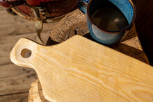 Top View Of Handmade Wooden Cutting Board And Ceramic Coffee Mug
