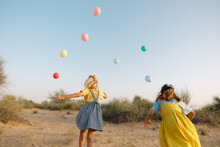 Children With Balloons Outdoors
