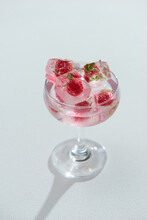 A Glass With Ice Cubes Of Strawberries