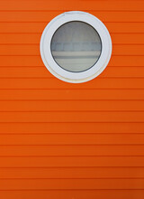 Round Window In Orange Wall