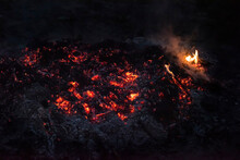 Smoldering Coals And Fire. Fire. Bonfire. Dark Photo.