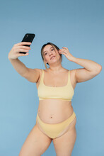 Curvy Woman Taking Selfie Seamless Background