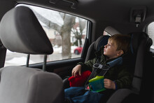 Little Boy Sitting In Car