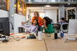 © Bisual Studio/Stocksy - Diverse colleagues reading report at desk in office