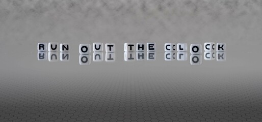 run out the clock word or concept represented by black and white letter cubes on a grey horizon background stretching to infinity